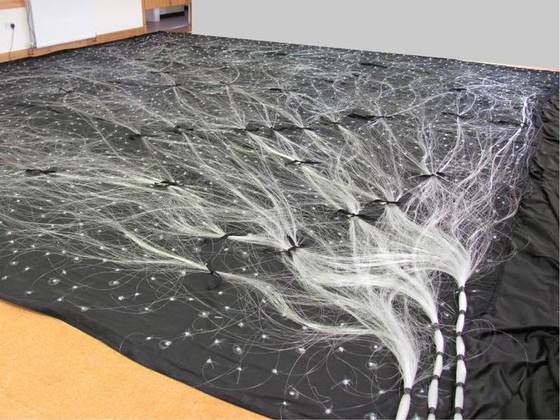 Fiber-optic strands laid out for the star ceiling